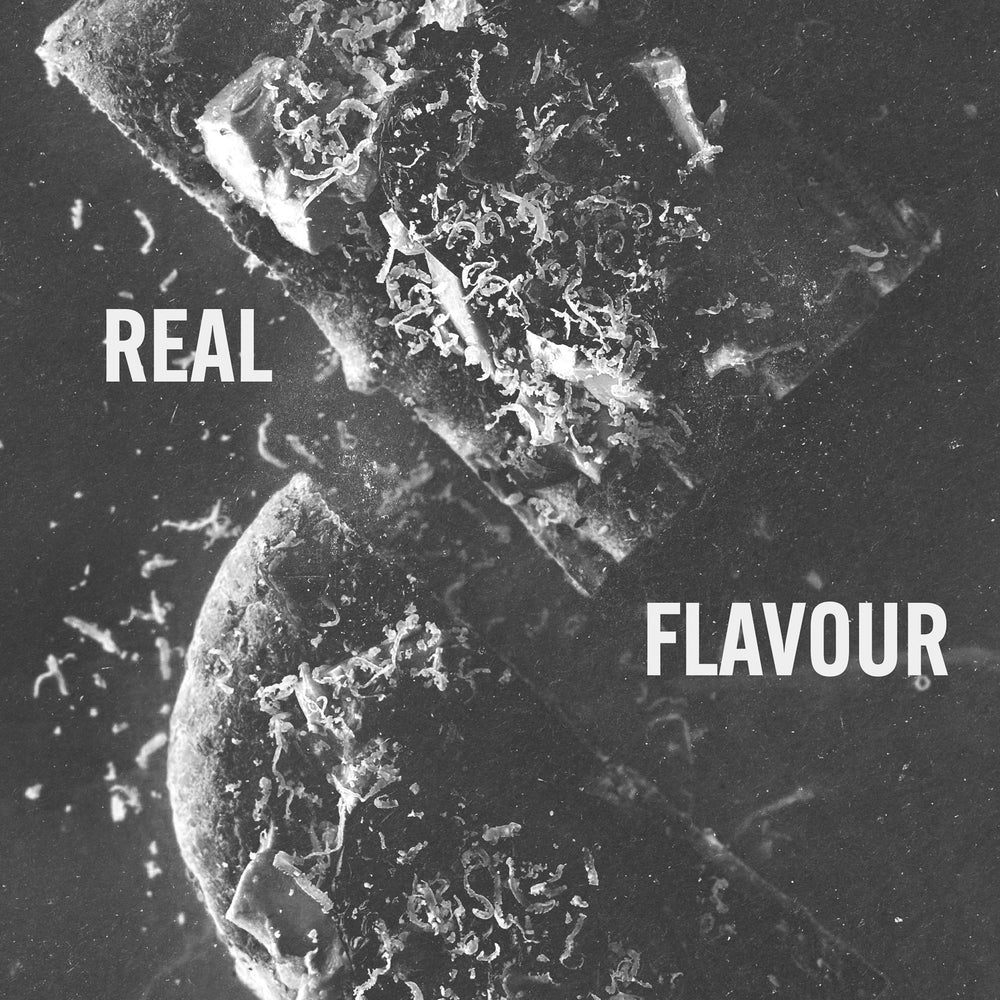 Black and white image of flat bread with the text that says Real Flavour | To The Next Journey