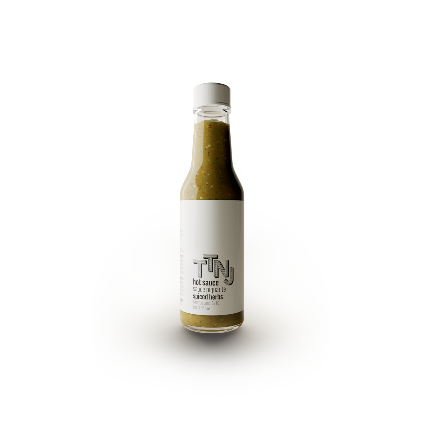 Single bottle with a white top and white label with the TTNJ logo and green spiced herbs sauce | To The Next Journey